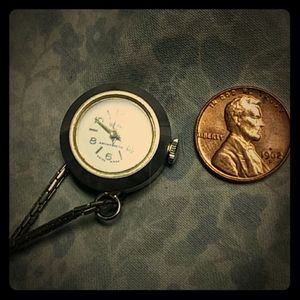 This is a nice silver& palladium knecklace watch.